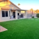Backyard with artificial grass, patio seating