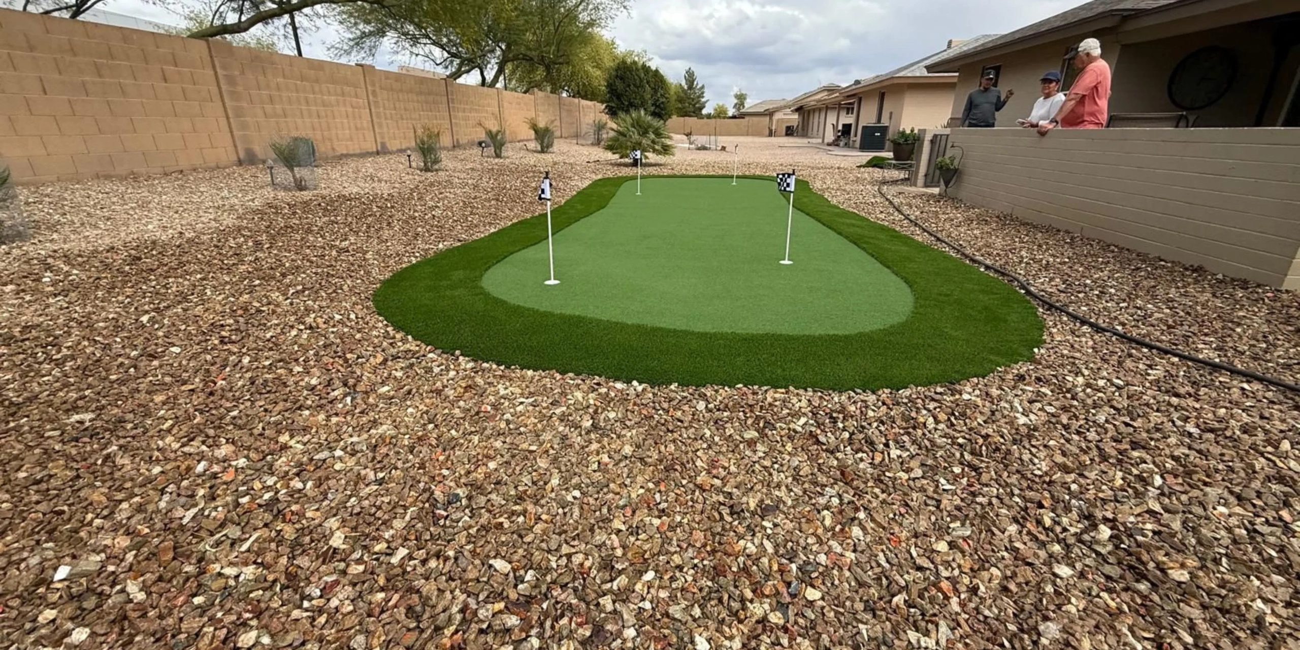 Backyard putting green with artificial turf