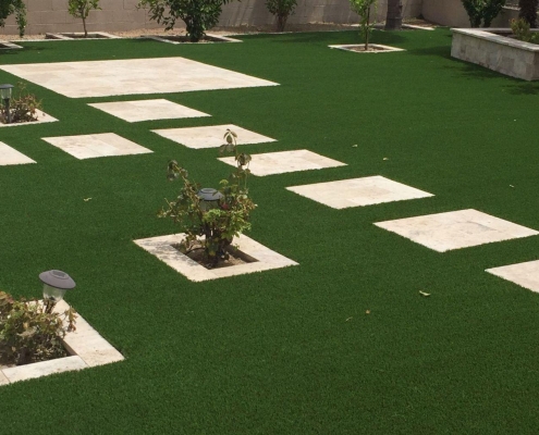 Artificial grass lawn with stepping stones