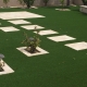 Artificial grass lawn with stepping stones