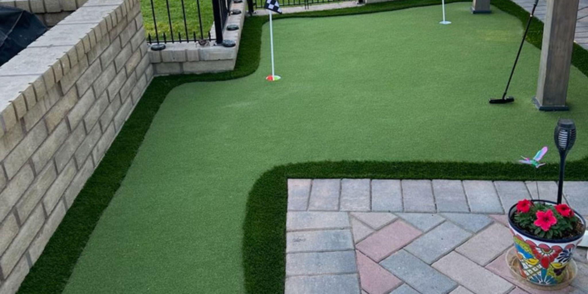 Artificial turf backyard with putting green
