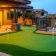 Modern backyard patio with a curved artificial putting green
