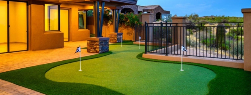 Modern backyard patio with a curved artificial putting green