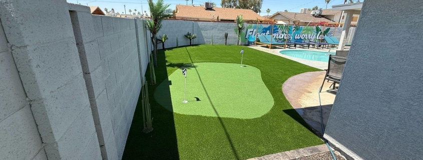 Backyard putting green with pool.