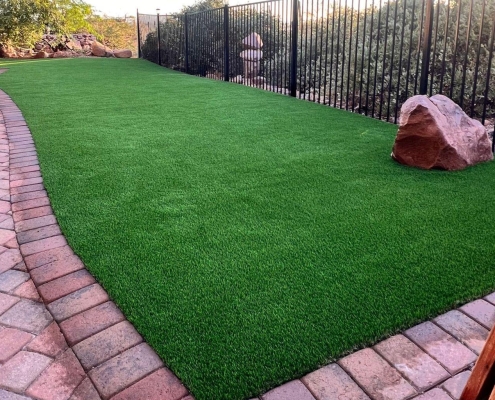 Backyard with a curved brick walkway
