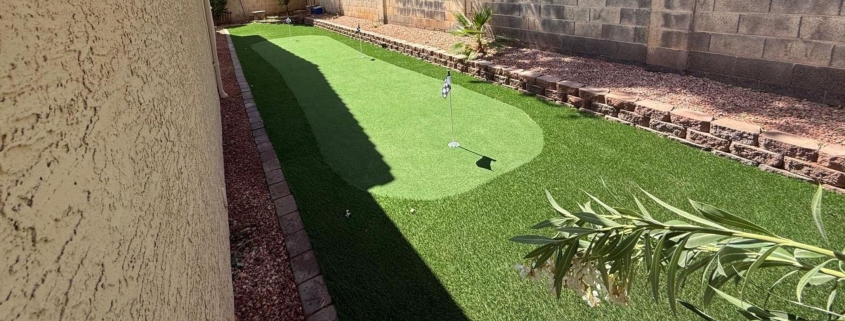 Backyard with artificial turf, a small putting green