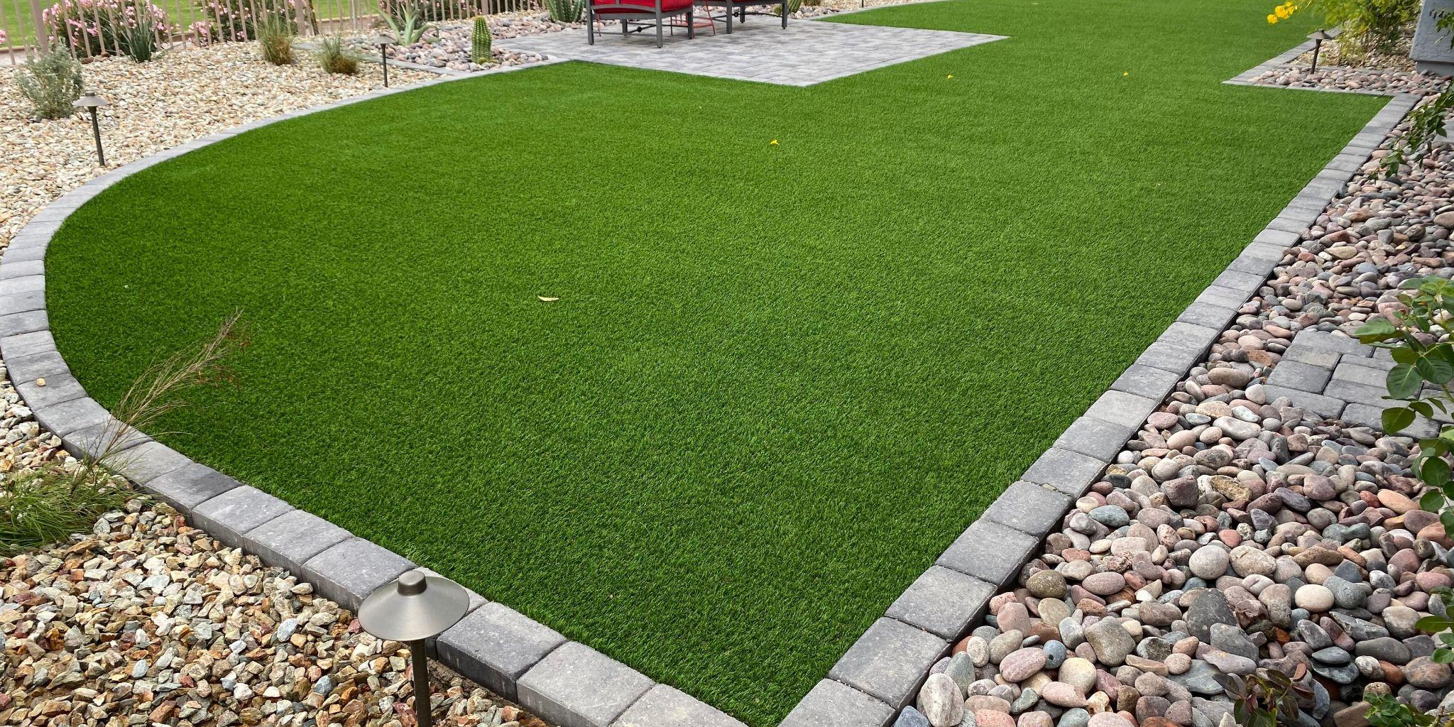  Artificial turf lawn bordered by stone edging 